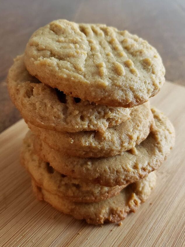 soft and chewy sourdough peanut butter cookies, sourdough peanut butter cookies stacked on wooden board