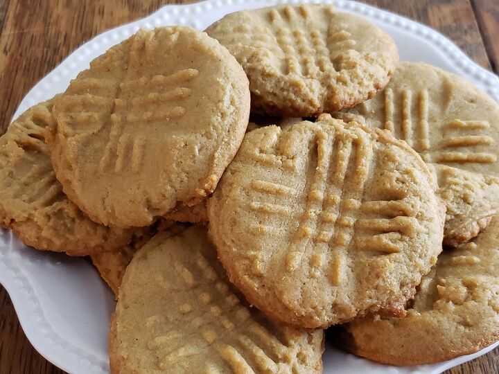 soft and chewy sourdough peanut butter cookies, sourdough peanut butter cookies on white plate