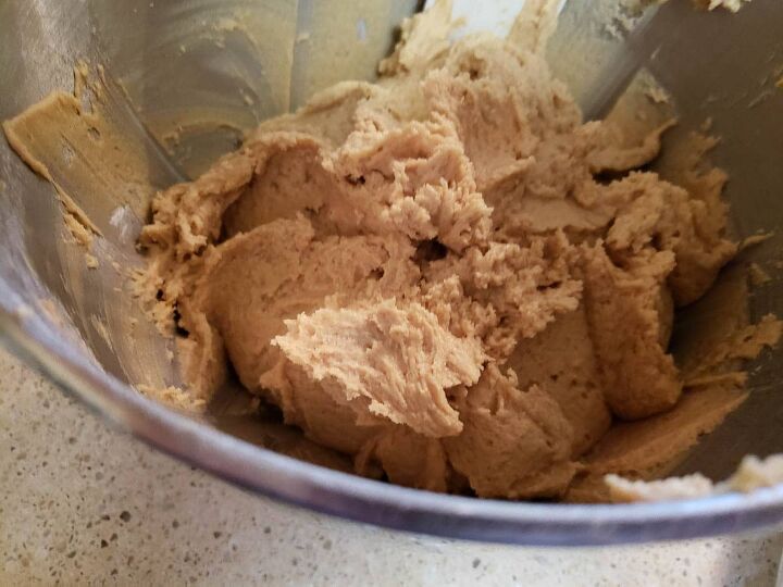 soft and chewy sourdough peanut butter cookies, sourdough peanut butter cookie dough in mixing bowl