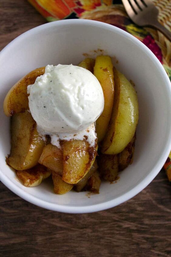southern style cinnamon fried apples, fried apples with ice cream in white bowl