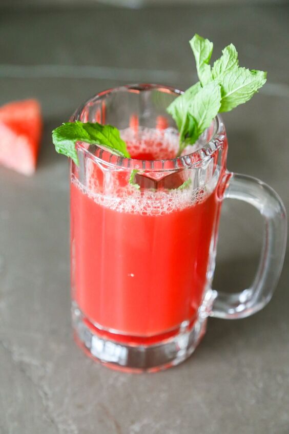 2 ingredient watermelon mint juice recipe, watermelon juice in a glass garnished with mint leaves