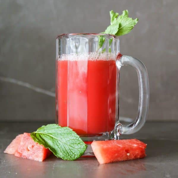 2 ingredient watermelon mint juice recipe, watermelon mint juice in a glass with mint leaves and watermelon chunks