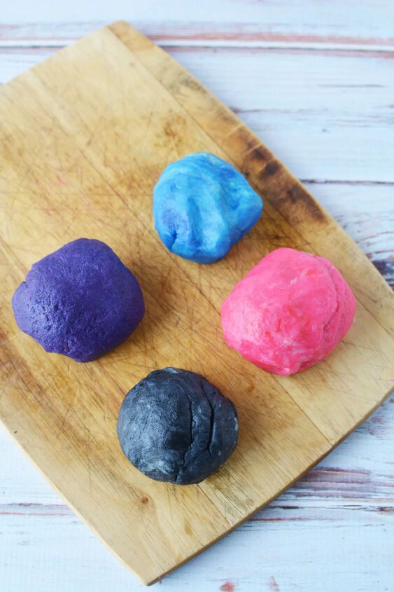mini space cookies how to make galaxy shortbread bites, Four round balls of colored shortbread dough