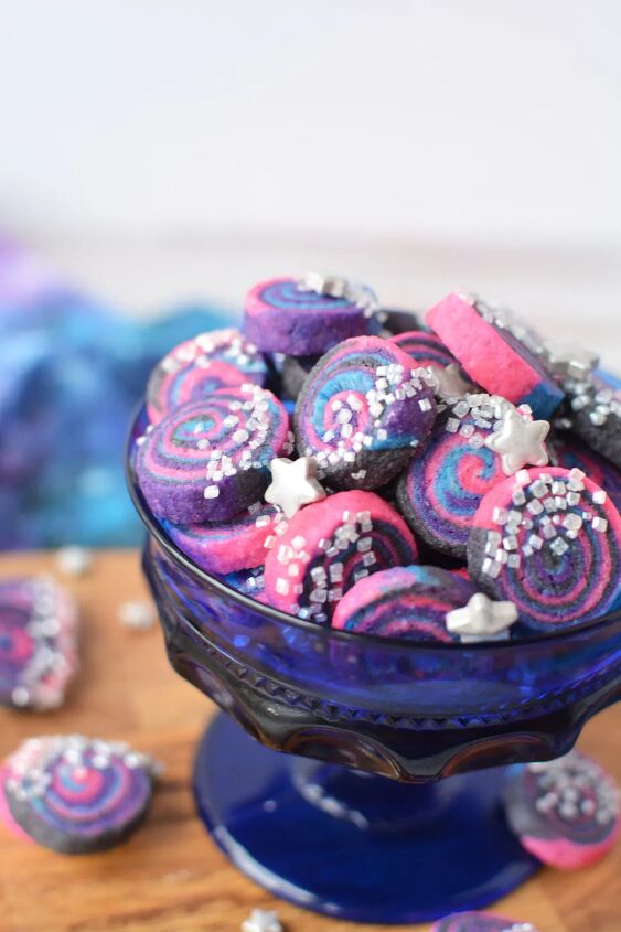mini space cookies how to make galaxy shortbread bites, Blue cup filled with mini space cookies with silver sprinkles