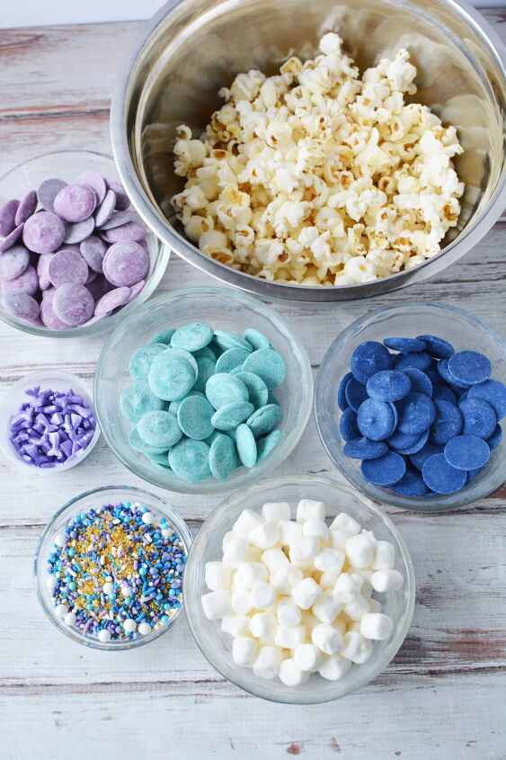 Bowls of popcorn candy melts and sprinkles