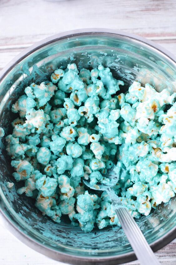 Popcorn coated with blue melted candy