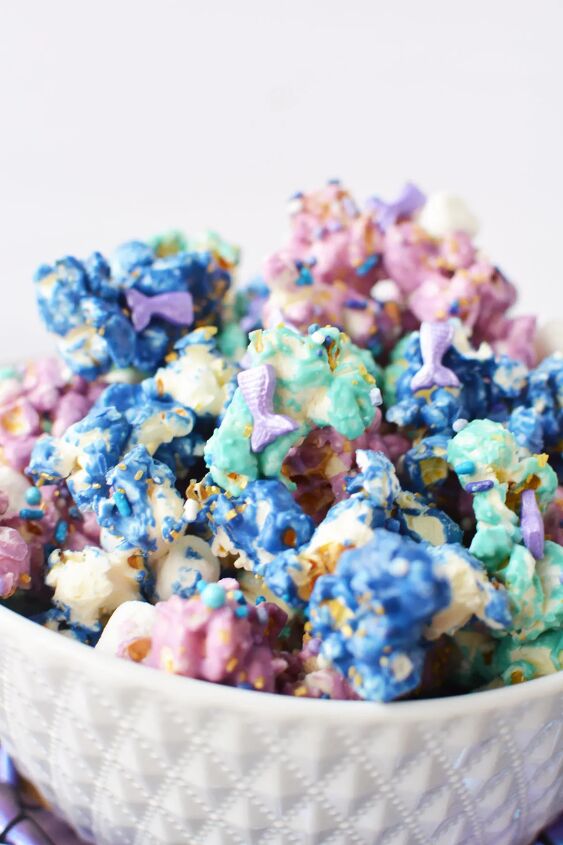 Blue green and purple popcorn with mermaid sprinkles and marshmallows