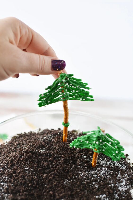 chocolate winter trifle with edible evergreen trees, Adding pretzel trees to the top of a trifle
