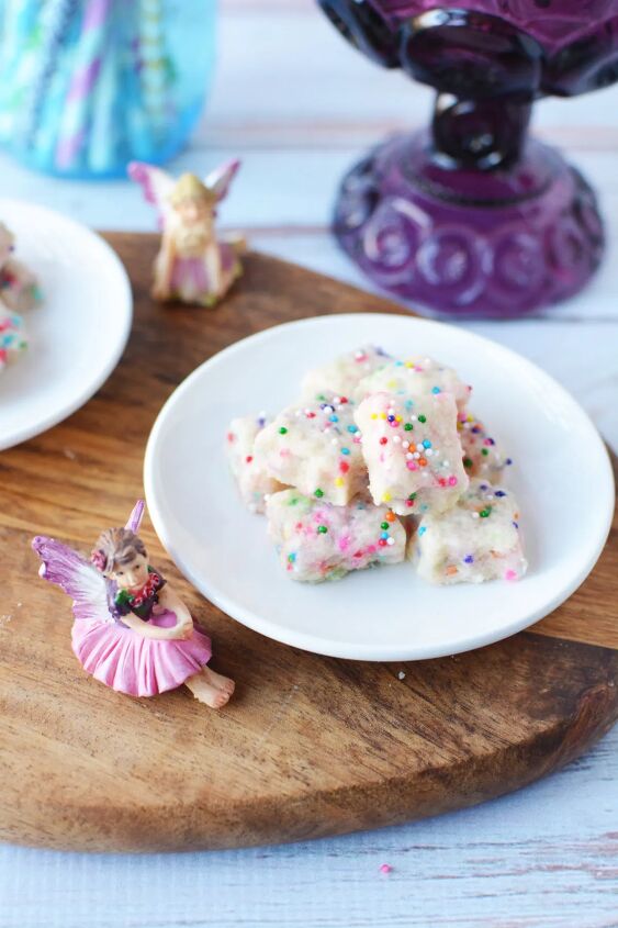 adorable fairy shortbread bites 100 mini cookies, A plate of shortbread bites next to fairy figurines
