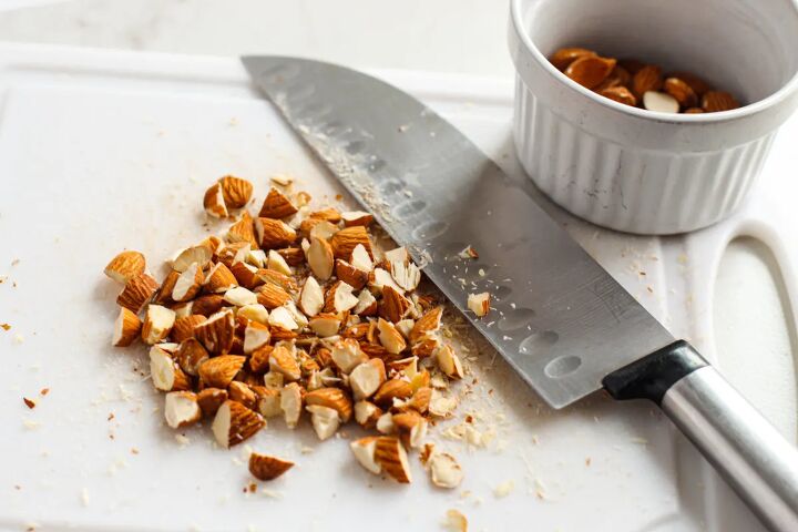 sweet and crunchy cherry chocolate granola bars recipe, Chopping nuts on a board