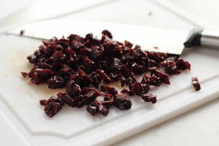 sweet and crunchy cherry chocolate granola bars recipe, Chopping cherries on a board