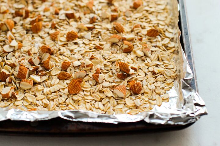 sweet and crunchy cherry chocolate granola bars recipe, Granola mixture in a pan
