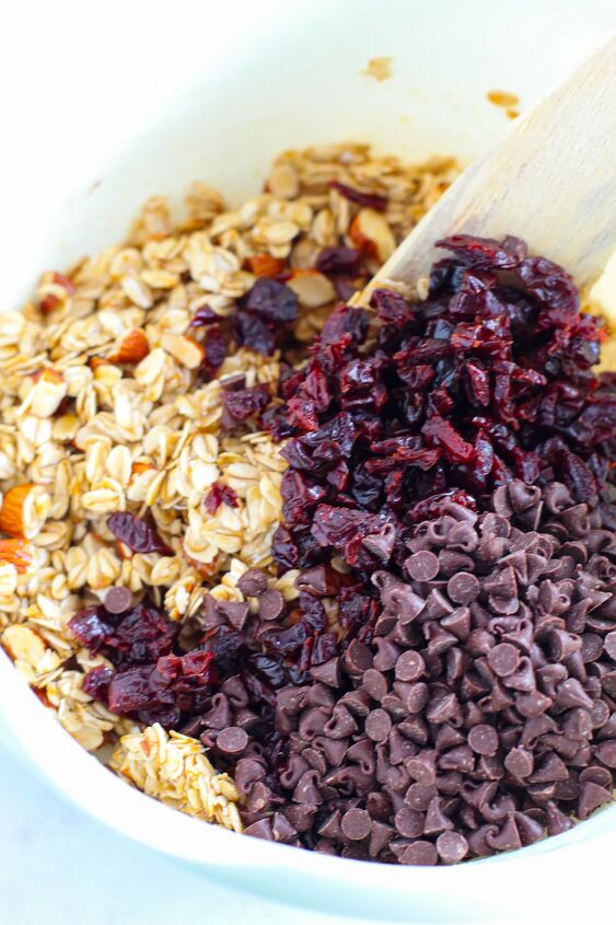 sweet and crunchy cherry chocolate granola bars recipe, Mixing cherries and chips into granola bar mixture