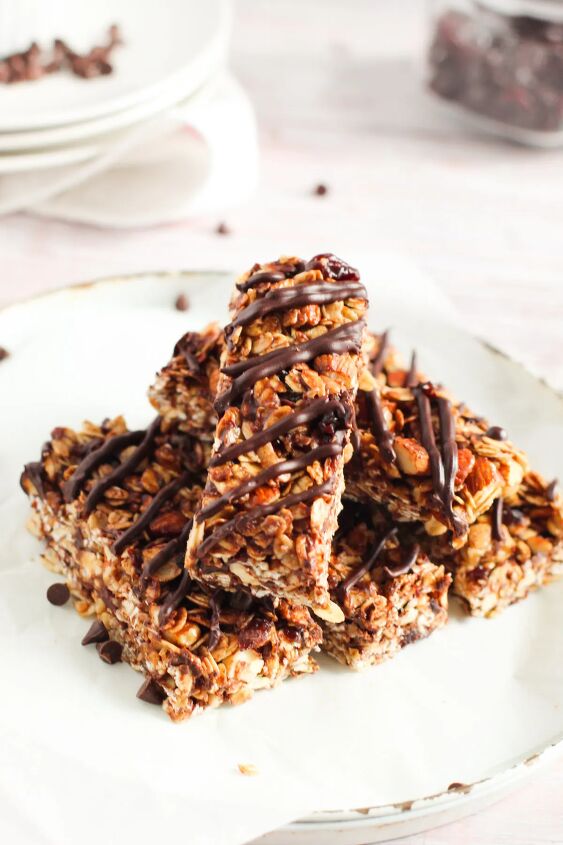sweet and crunchy cherry chocolate granola bars recipe, Chocolate cherry granola bars stacked on a plate