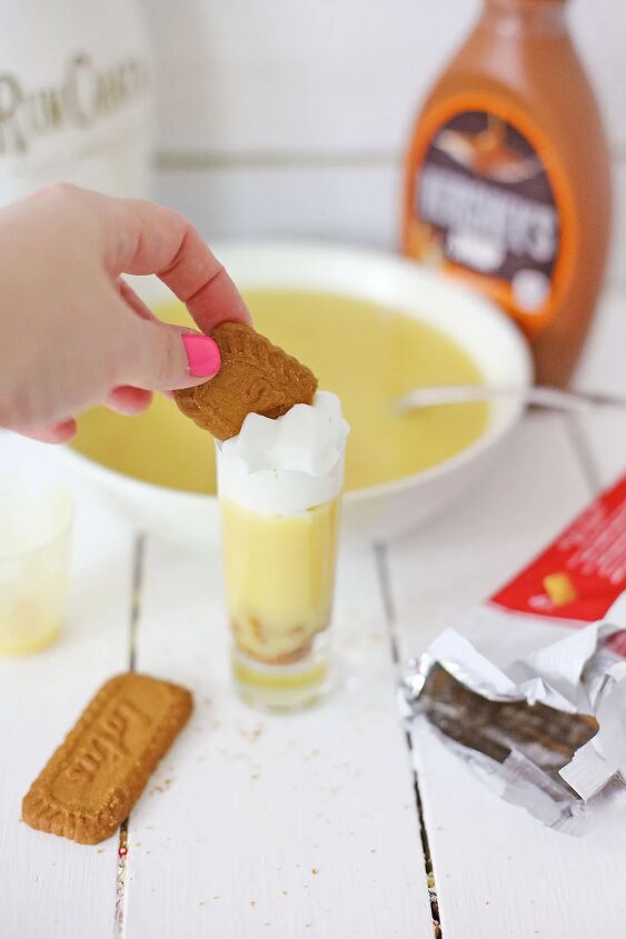 biscoff cookie rumchata pudding shots recipe, Adding 1 2 of a Biscoff cookie to the top of a RumChata pudding shot