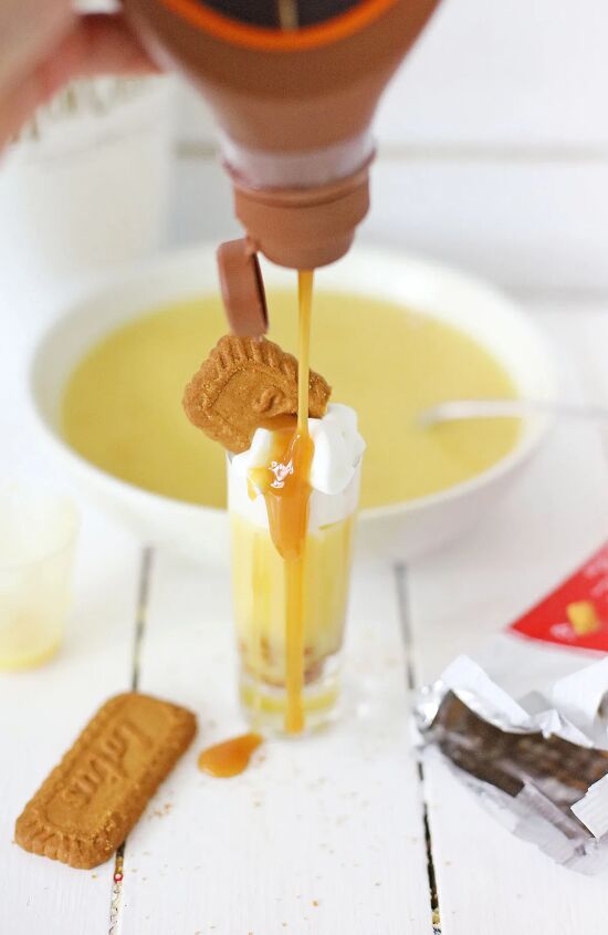 biscoff cookie rumchata pudding shots recipe, Drizzling caramel syrup on top of a pudding shot