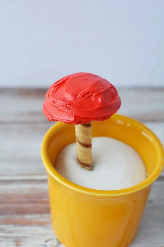 delicious and enchanting woodland fairy toadstool trifle recipe, Edible toadstool in a cup filled with sugar