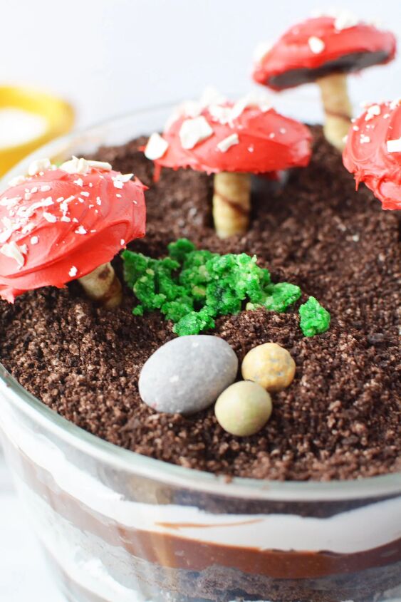 delicious and enchanting woodland fairy toadstool trifle recipe, Candy rocks edible moss and cookie mushrooms on a trifle