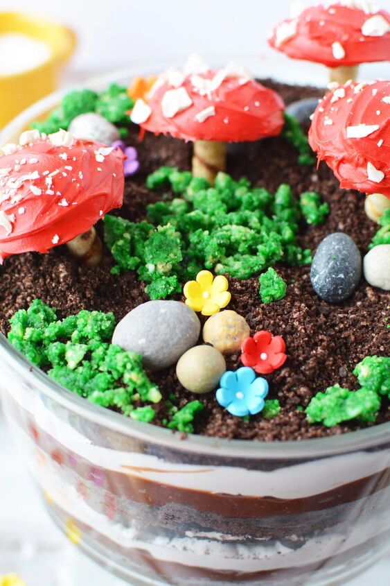 delicious and enchanting woodland fairy toadstool trifle recipe, Edible rocks flowers and toadstools on top of a trifle