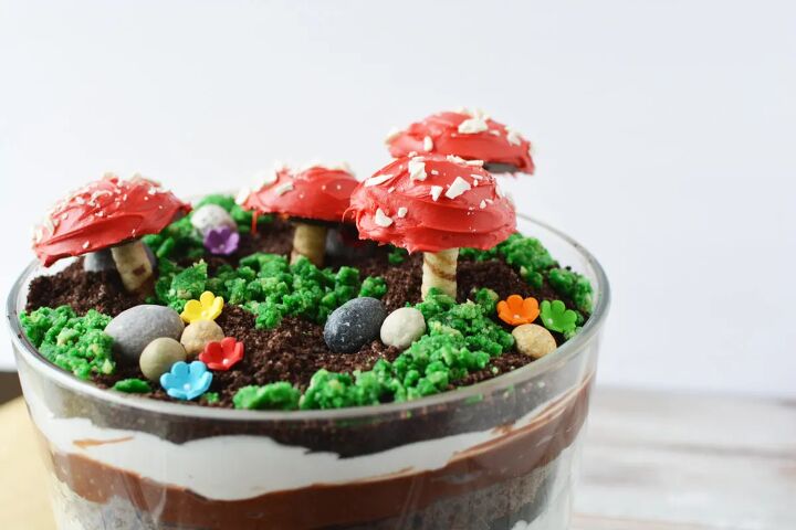 delicious and enchanting woodland fairy toadstool trifle recipe, Fairy garden trifle with cookie toadstools candy rocks and edible moss