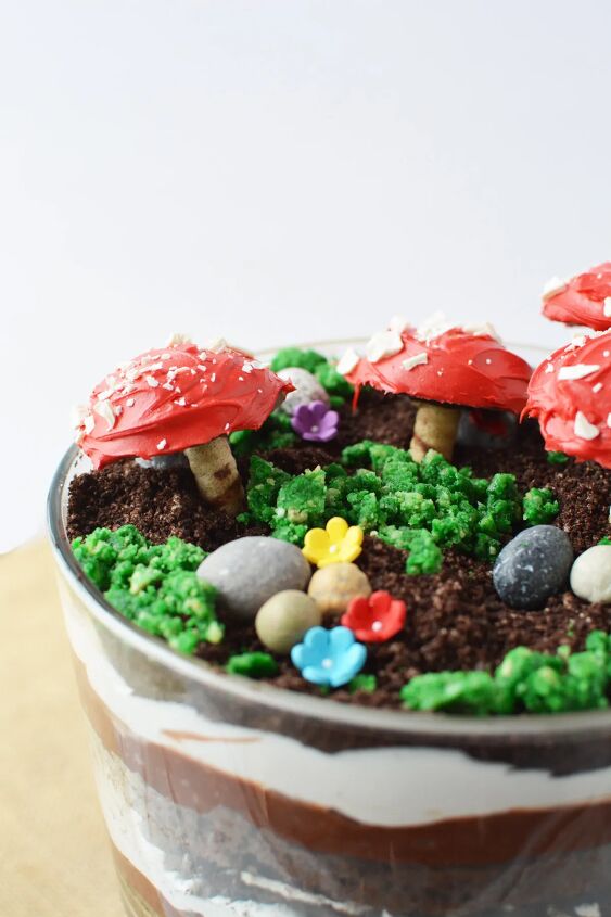 delicious and enchanting woodland fairy toadstool trifle recipe, Woodland fairy trifle with edible flowers moss and toadstools