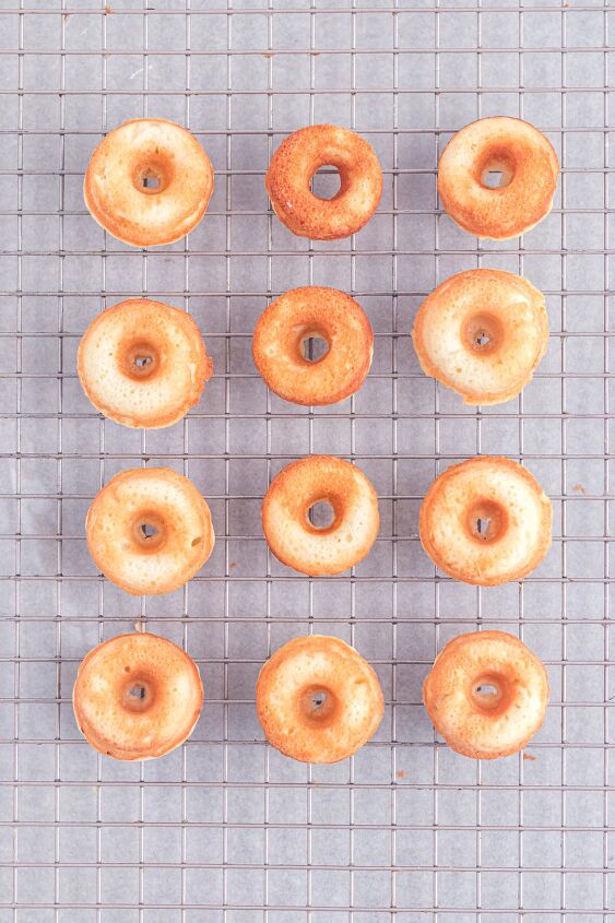 bright and delicious mini donuts with colorful glaze little fairy do, Baked mini donuts on a cooling rack