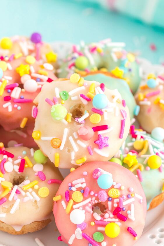 bright and delicious mini donuts with colorful glaze little fairy do, Pink yellow and blue mini donuts with sprinkles
