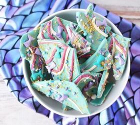 sparkly mermaid bark candy for an easy under the sea sweet, Bowl of pieces of mermaid bark candy on top of a fabric with scales