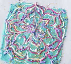 sparkly mermaid bark candy for an easy under the sea sweet, Swirls of candy melts and sprinkles on parchment paper on a sheet