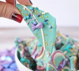 sparkly mermaid bark candy for an easy under the sea sweet, Holding a piece of mermaid bark with the bowl in the bacground