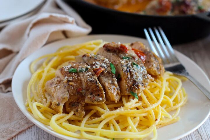 marry me chicken the perfect recipe for a delicious and hearty dinner, Marry Me chicken sliced on top of pasta on a plate