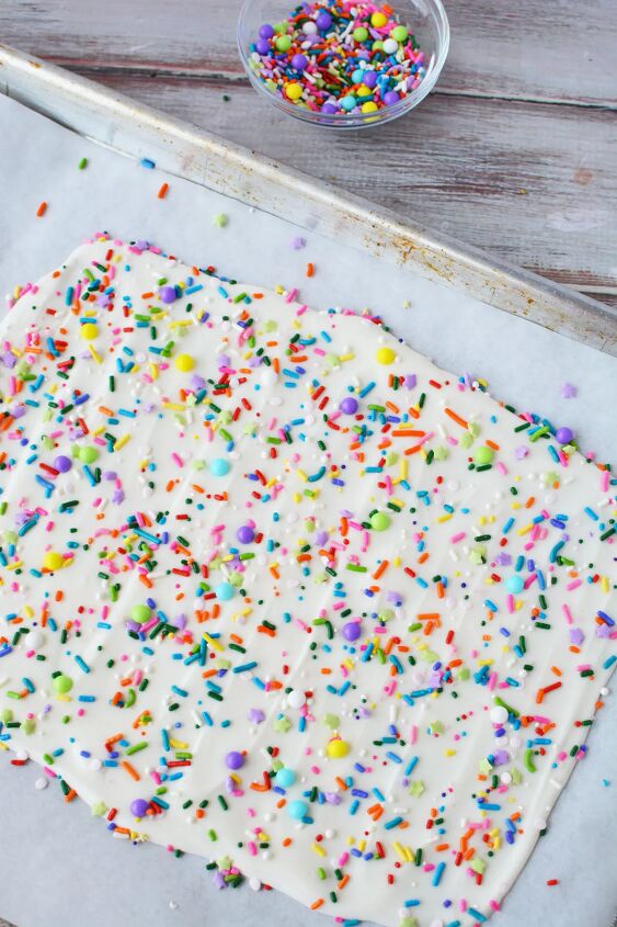 funfetti frenzy how to make delicious funfetti bark candy, Confetti bark candy on a baking sheet ready to set