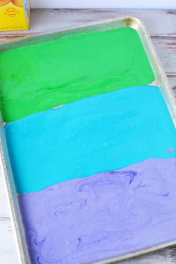 how to make a rainbow trifle dessert for a magical party, Green blue and purple cake batter in a baking pan