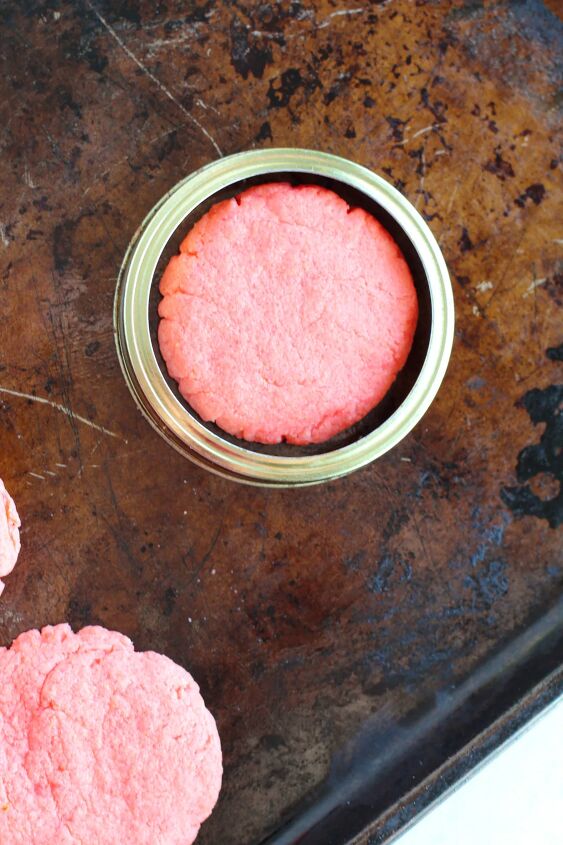 easy and chewy strawberry cake mix cookies recipe, Mason jar ring around a cookie on a baking sheet