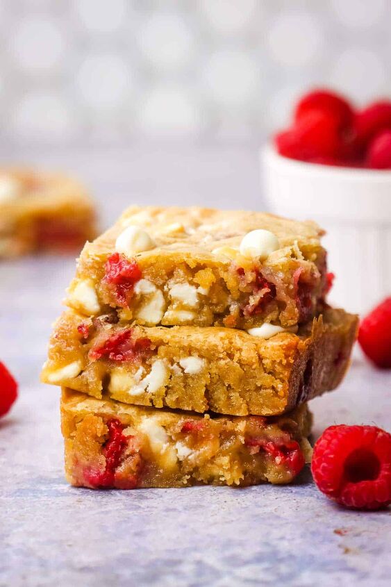 white chocolate and raspberry blondies, A stack of three white chocolate raspberry blondies