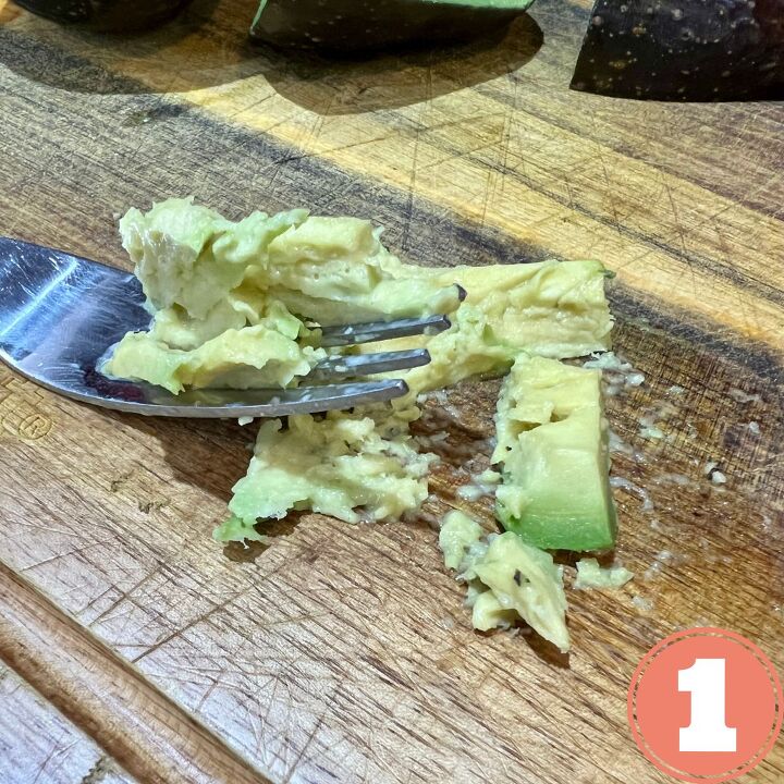 fudgy tik tok mug brownies, a fork smashing an avocado on a wooden cutting board