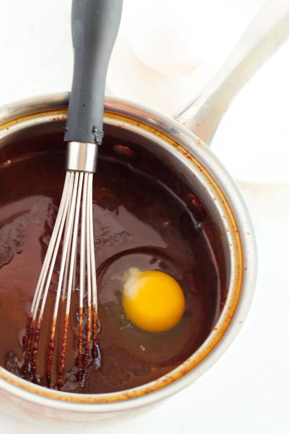 mocha dark chocolate fudgy brownies recipe, Eggs in brownie batter in a pan with a whisk