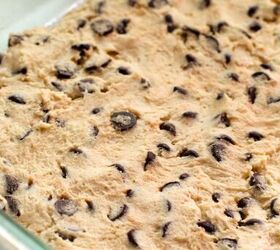 salted caramel chocolate chip cookie bars recipe, Cookie dough in a baking pan