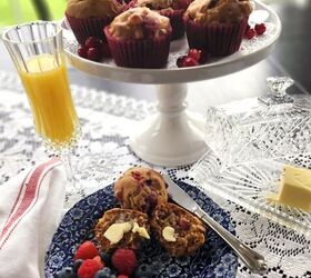 best cranberry walnut muffin recipe with orange marmalade, cranberry walnut muffins on a white pedestal dish with orange juice and butter dish on the side