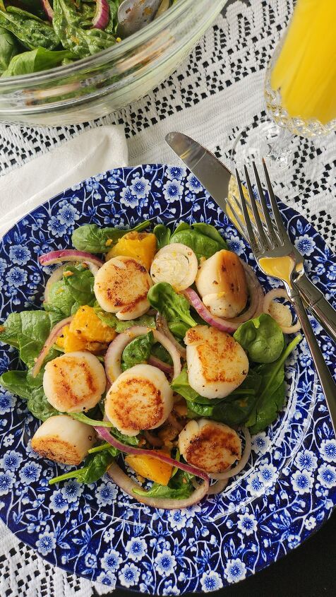 scallop salad recipe with orange honey walnut vinaigrette, overhead photo of orange scallop salad with red onions
