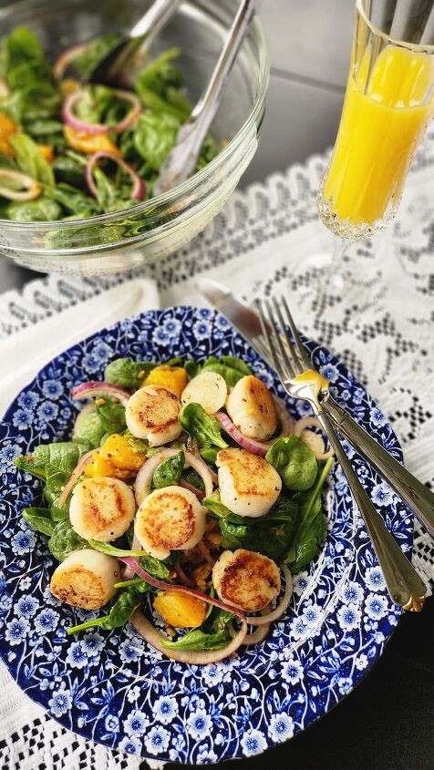 scallop salad recipe with orange honey walnut vinaigrette, scallop salad overhead photo with mimosa on side of dish