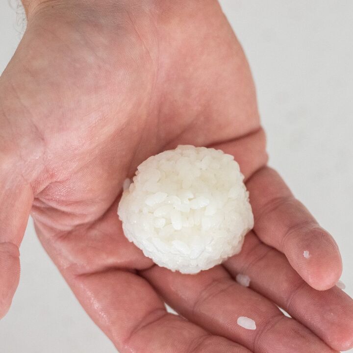 A sushi ball in a hand