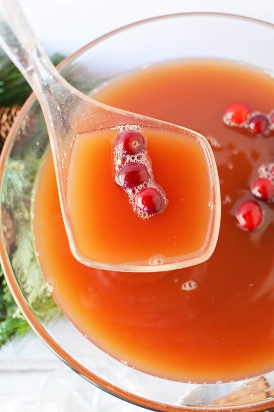 cranberry and cinnamon christmas punch recipe, Ladle of punch above the bowl
