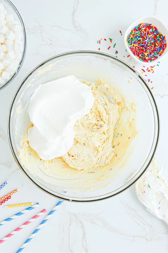 happy birthday cake fluff salad recipe, Whipped topping in pudding mixture in a bowl
