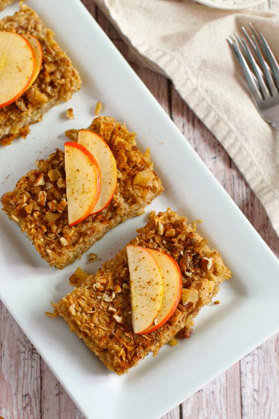 spiced apple baked oatmeal, Slices of apple baked oatmeal on a white dish