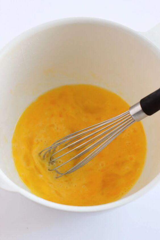 pumpkin snack cakes, Eggs in a bowl with a whisk