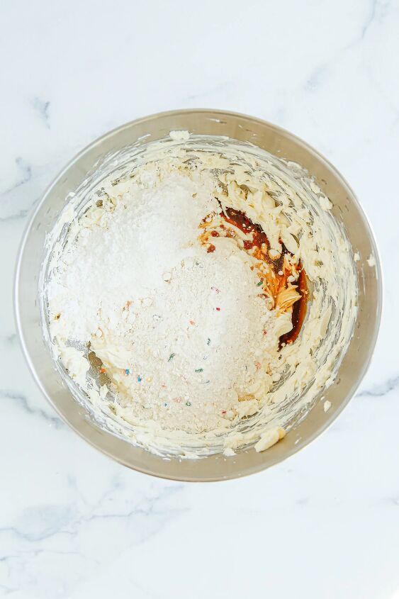 funfetti cream cheese ball dip, Cream cheese vanilla and powdered sugar in a mixing bowl