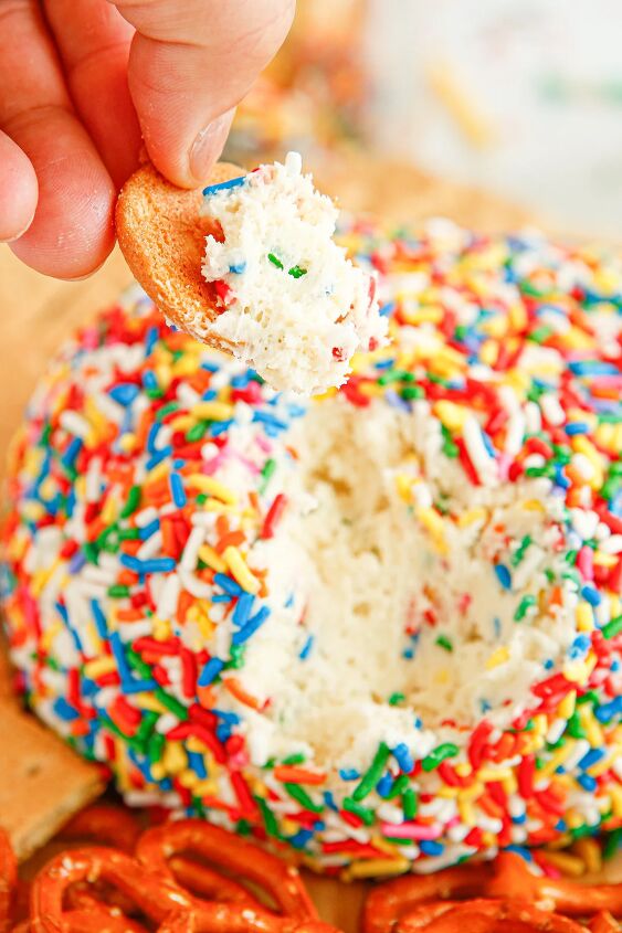 funfetti cream cheese ball dip, Dipping a cracker into a cheese ball covered in sprinkles
