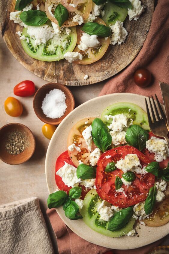 caprese salad, Two Caprese salads with salt pepper and cherry tomatoes