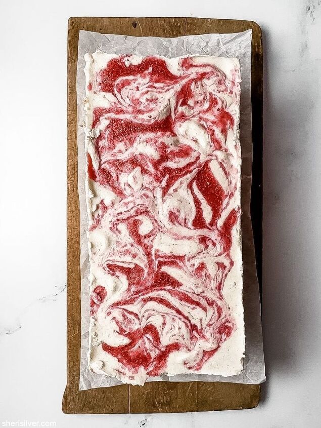 high protein strawberry cottage cheese ice cream bars, strawberry cottage cheese ice cream bar on a wooden board